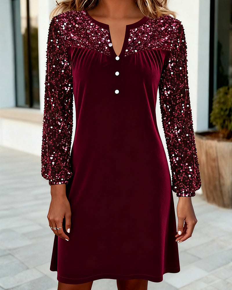 Elegant women's festive dress with shimmering long sleeves, perfect for celebrations and holiday parties.