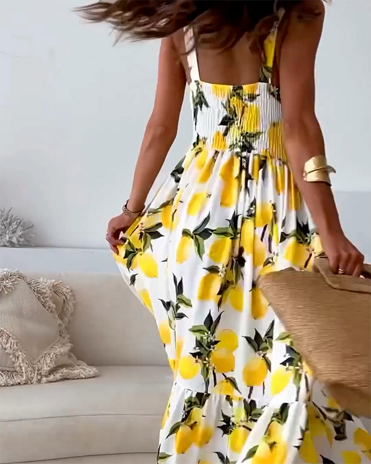 Zesty lemon print casual sundress for women. This vibrant strap dress is a cheerful choice for summer fashion.