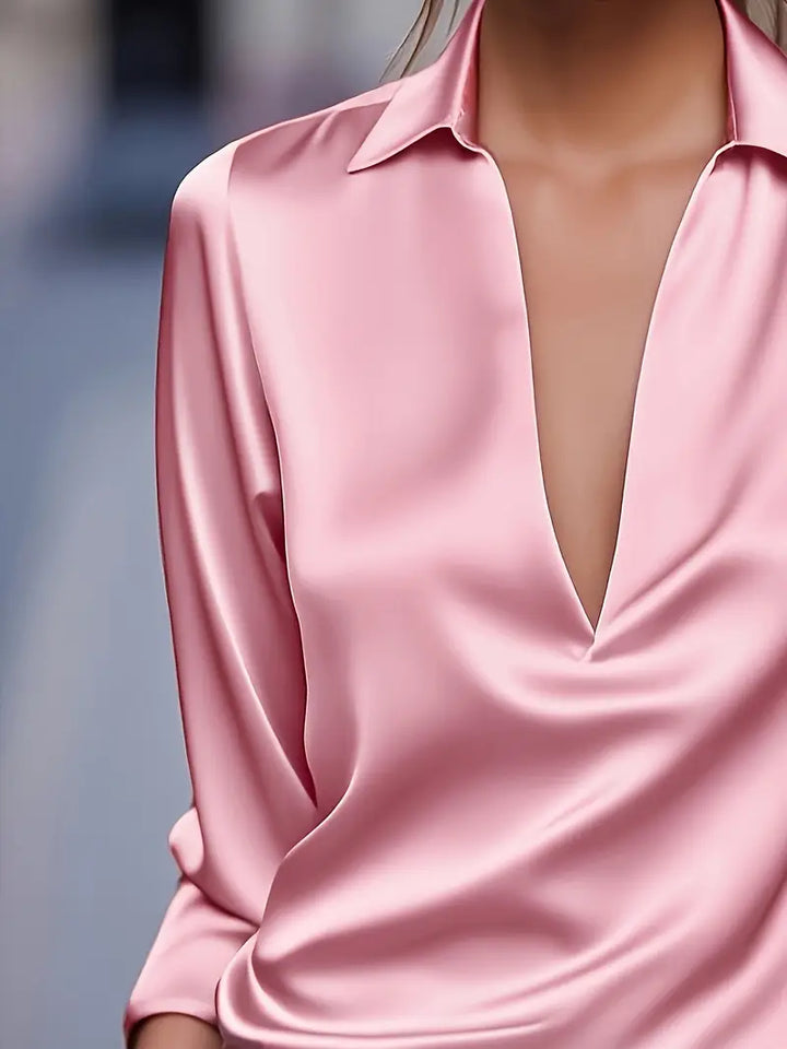 Elegant women's button-down blouse, V-neck, long sleeve. Collared design for office, work, or casual wear.