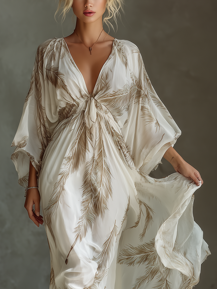 Women's spring/summer palm leaf maxi dress. Elegant V-neck, dolman sleeves, & unique twisted front detail.