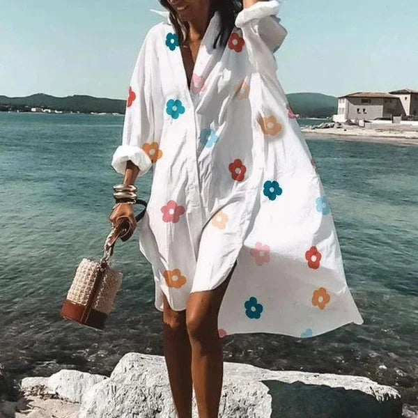 Stylish women's mid-length shirt dress with a polo collar, great for casual summer outings.