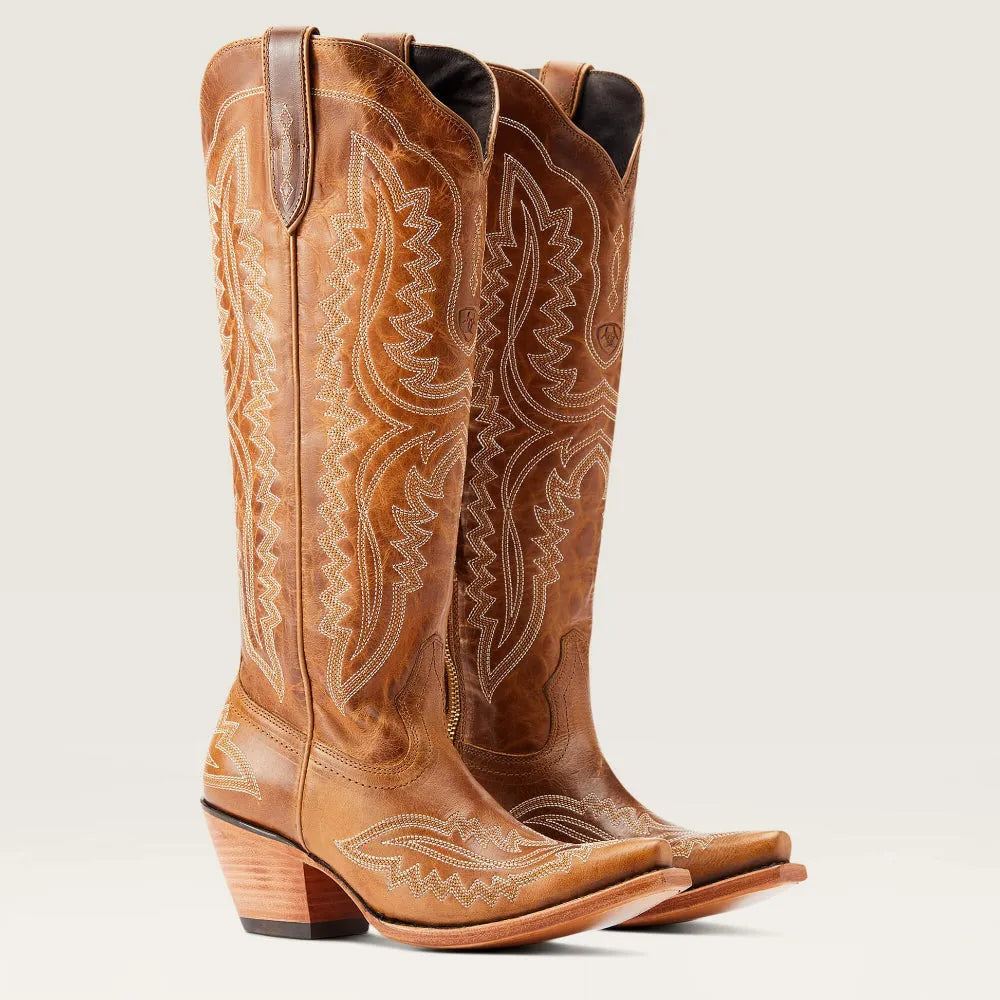 Front view of fashionable women's patterned tall boots, showcasing the pointed toe and knee-high cut.