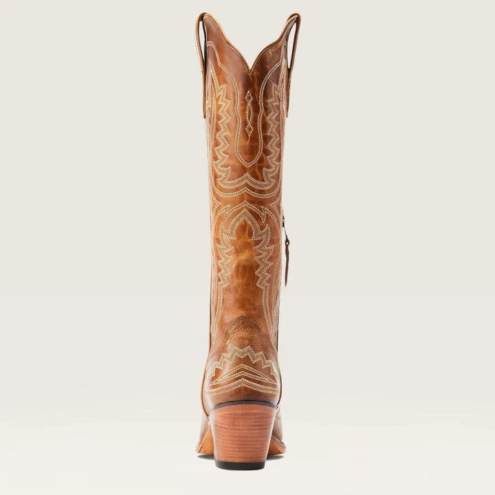 Full body shot of women's stylish knee-high patterned boots, featuring a pointed toe and practical zip.