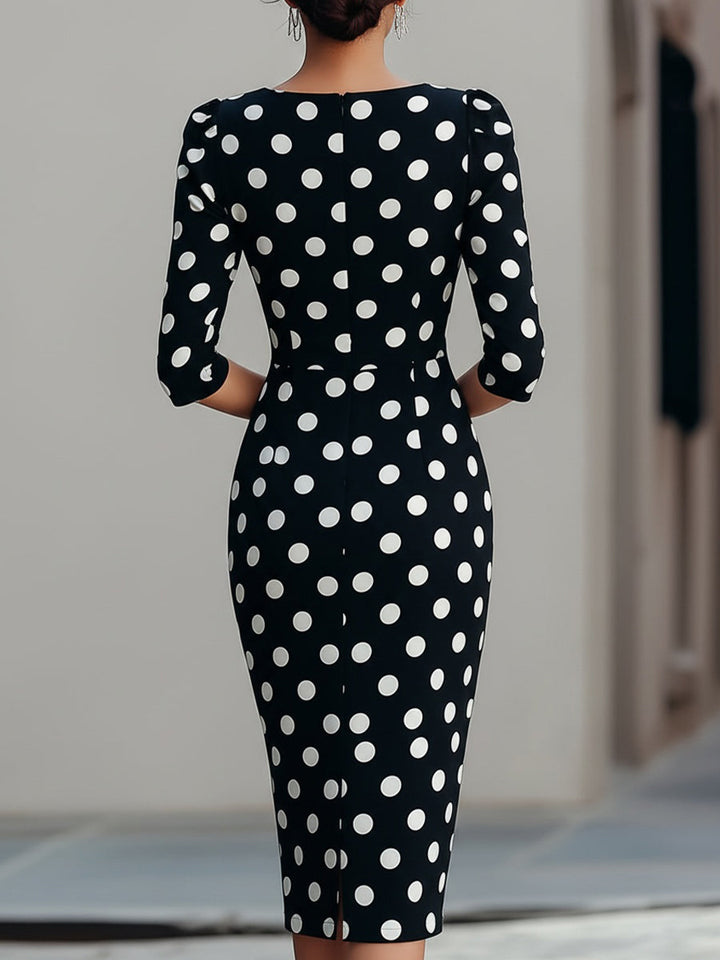 Stylish women's black halter neck bodycon midi cocktail dress, featuring an elegant dot print for evening events.