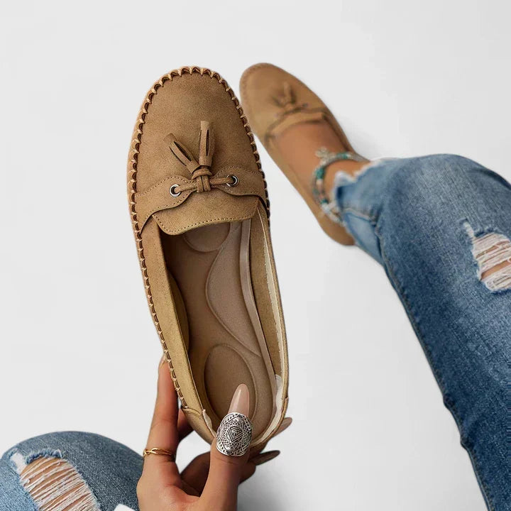 Women's comfortable loafers with decorative tassel & bow, offering orthopaedic support for daily wear.