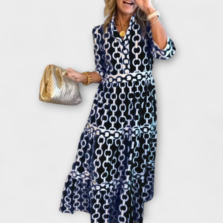 Sophisticated women's midi dress featuring a stylish chain print and classic collar. Perfect for fall fashion.