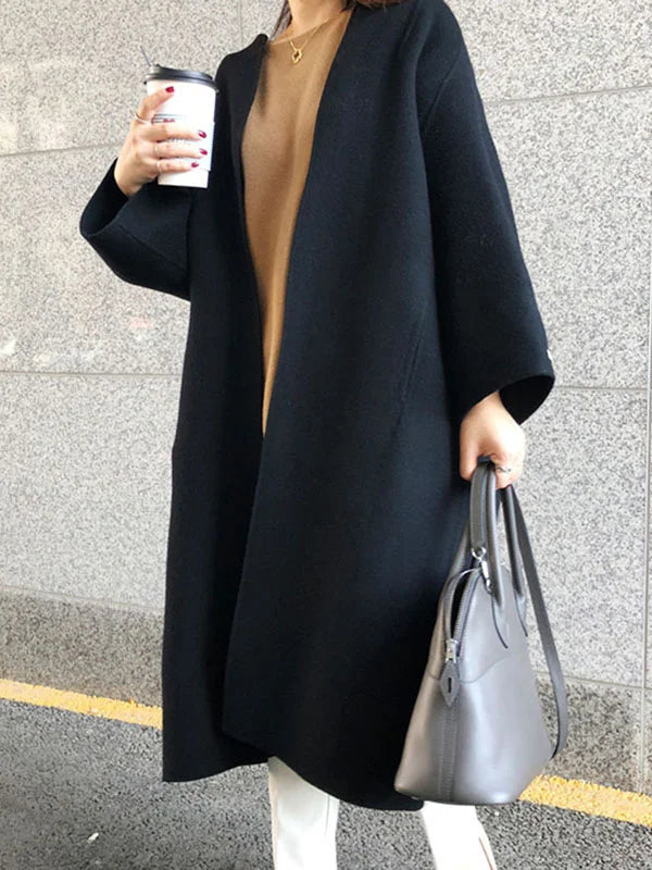 Versatile women's long brown coat, a chic outerwear piece for elegant winter fashion & warmth.