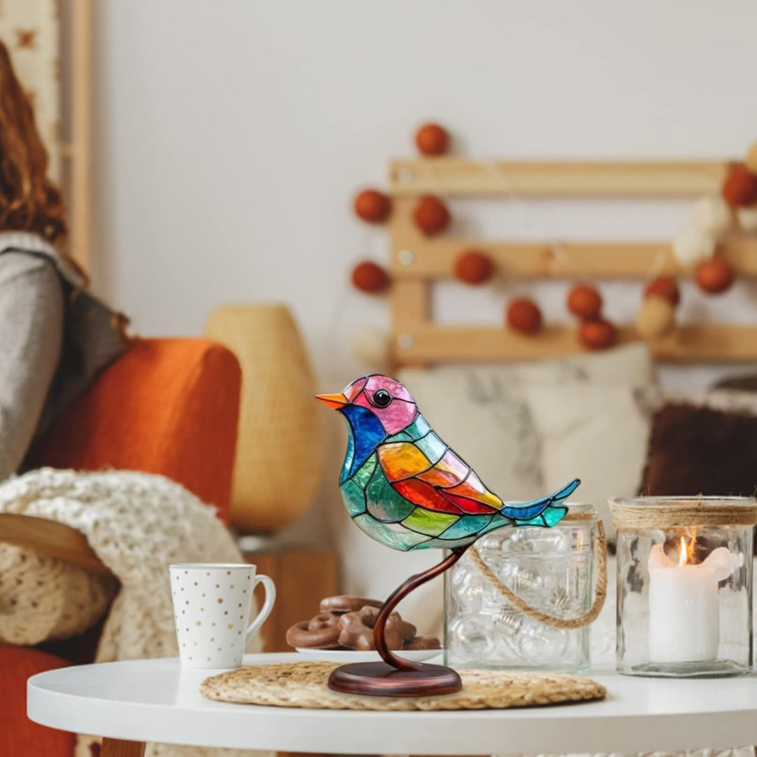 Artistic modern bird sculpture with coloured glass, an elegant home decor tabletop accent.