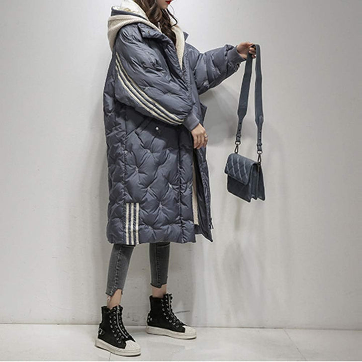 Cozy women's hooded puffer jacket, perfect for winter, providing ultimate warmth & stylish outerwear.