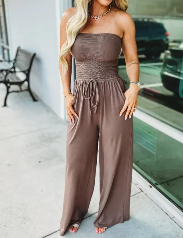 Women's elegant off-shoulder smocked jumpsuit, perfect for summer fashion.