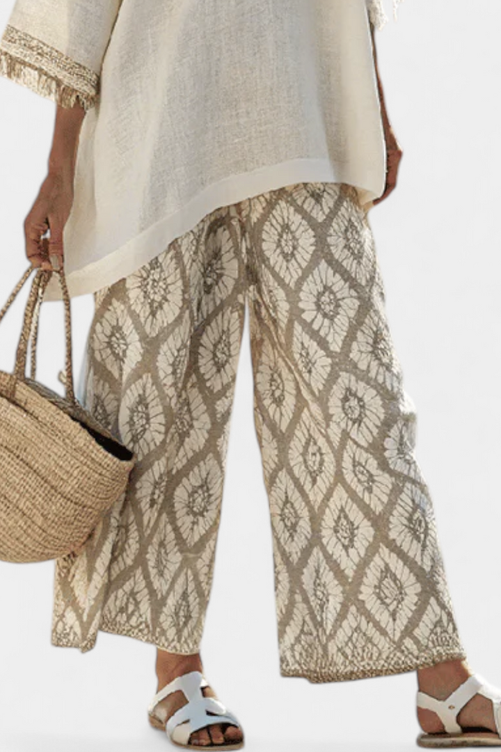 Stylish women's two-piece matching set: elegant top & wide-leg ethnic print pants. Ideal summer fashion.