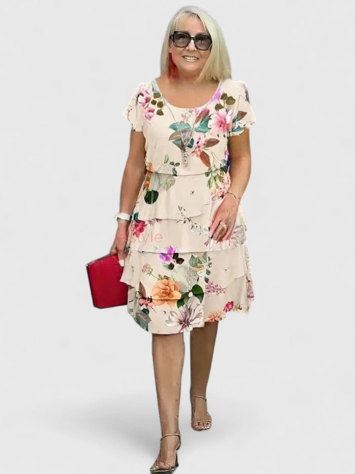 Comfortable women's floral tiered summer dress, versatile for casual outings or elegant parties.
