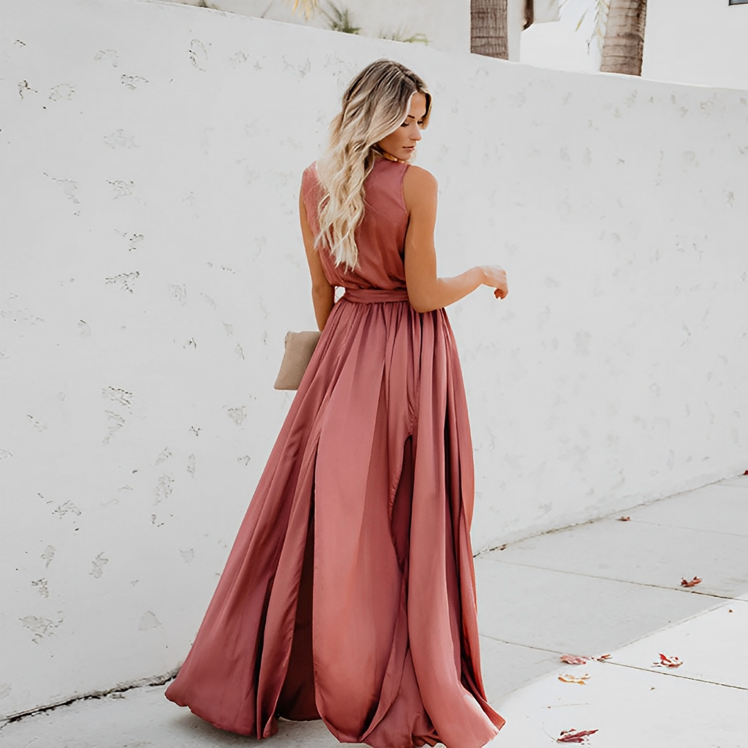 Sleeveless V-neck maxi dress for women, featuring a stylish waist belt and leg slit, ideal for evening events.