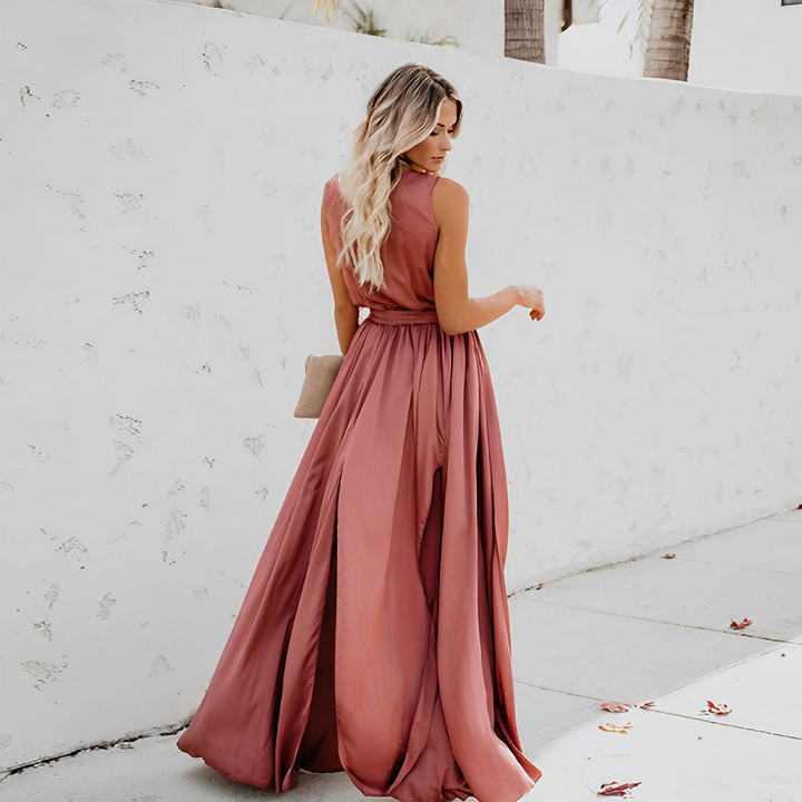 Sleeveless V-neck maxi dress for women, featuring a stylish waist belt and leg slit, ideal for evening events.