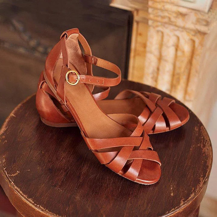 Adjustable slip-on women's sandals with stylish low straps. Comfortable summer flats footwear.