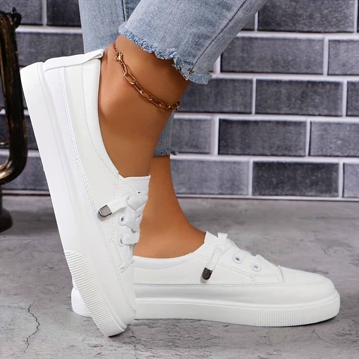 Everyday white lace-up trainers for women, offering orthopaedic comfort & arch support.