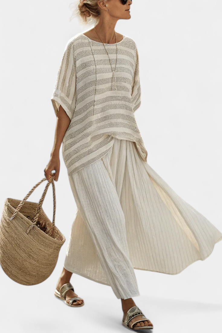Women's striped top & flowing wide-leg pants two-piece set, perfect for summer vacation or resort wear.