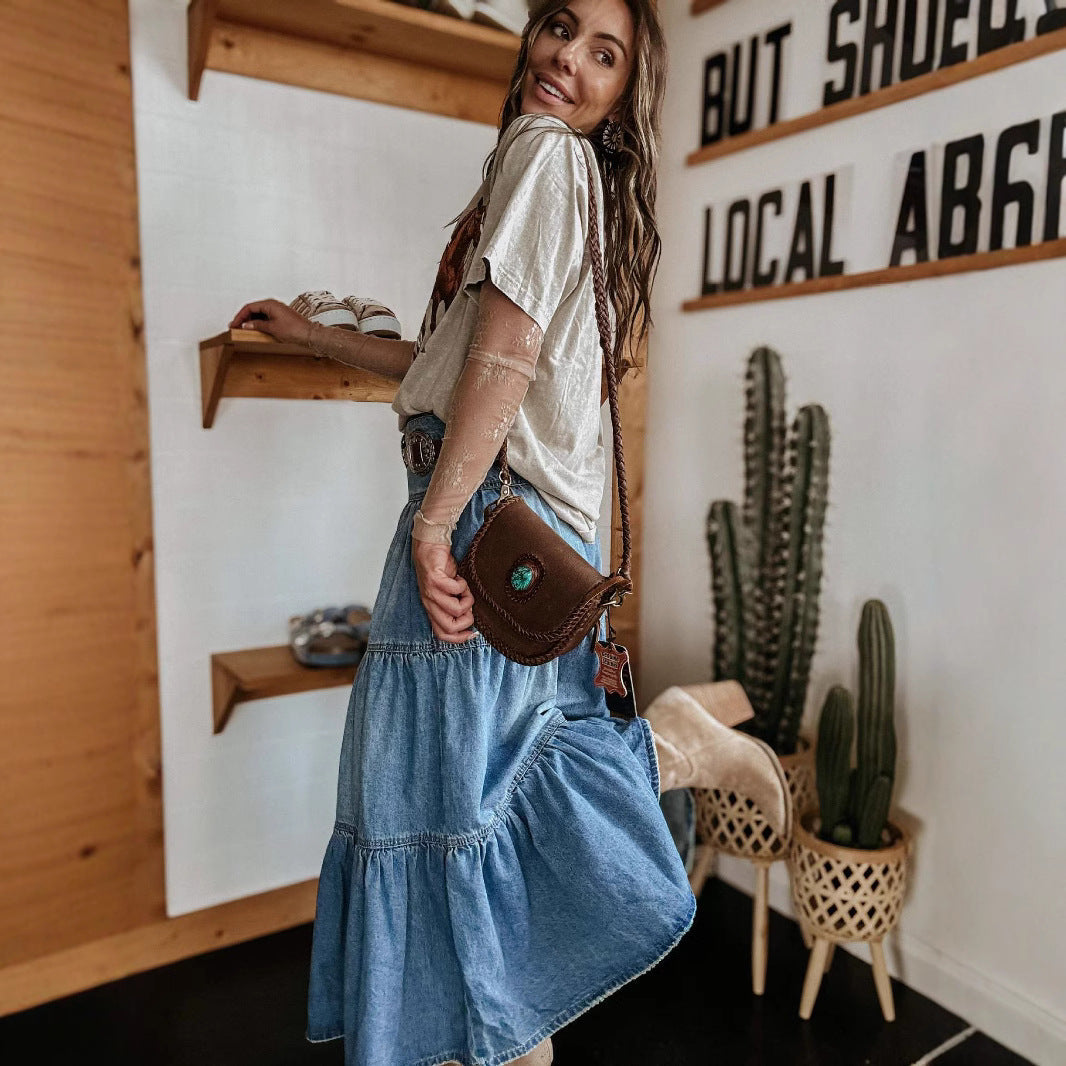 Flared women's tiered maxi skirt featuring a chic button front and fashionable raw hem for versatile styling.