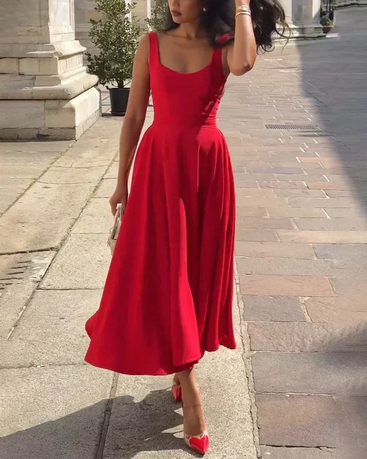 Stunning women's red fitted midi dress featuring delicate straps, an elegant choice for any occasion.
