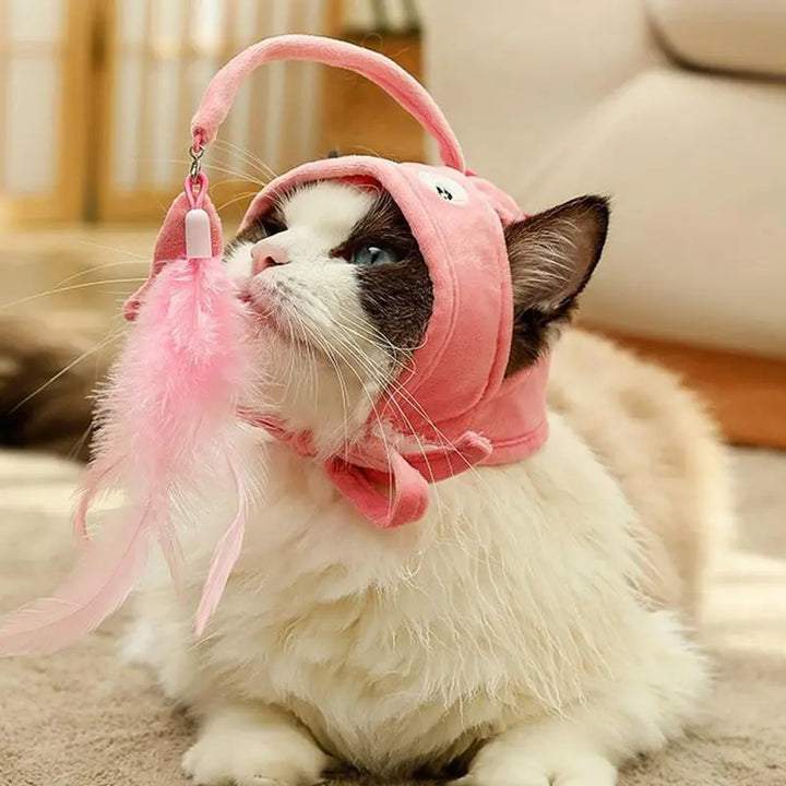 Funny cat costume hat with an interactive toy pendant, perfect for playful felines.