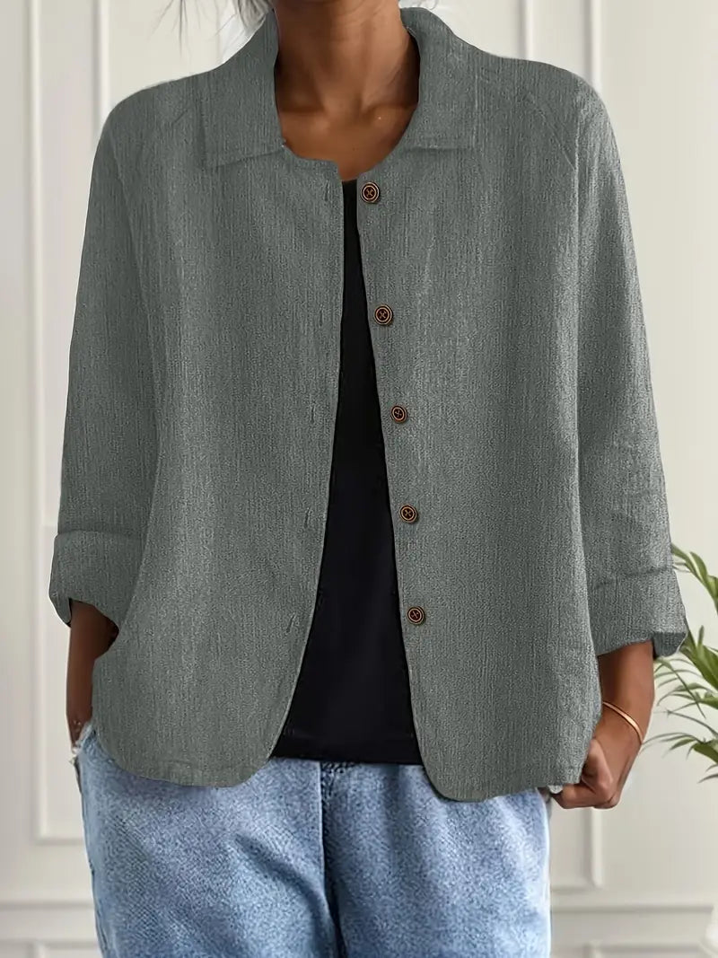Elegant women's collared three-quarter sleeve blouse, a stylish button-down for professional workwear.