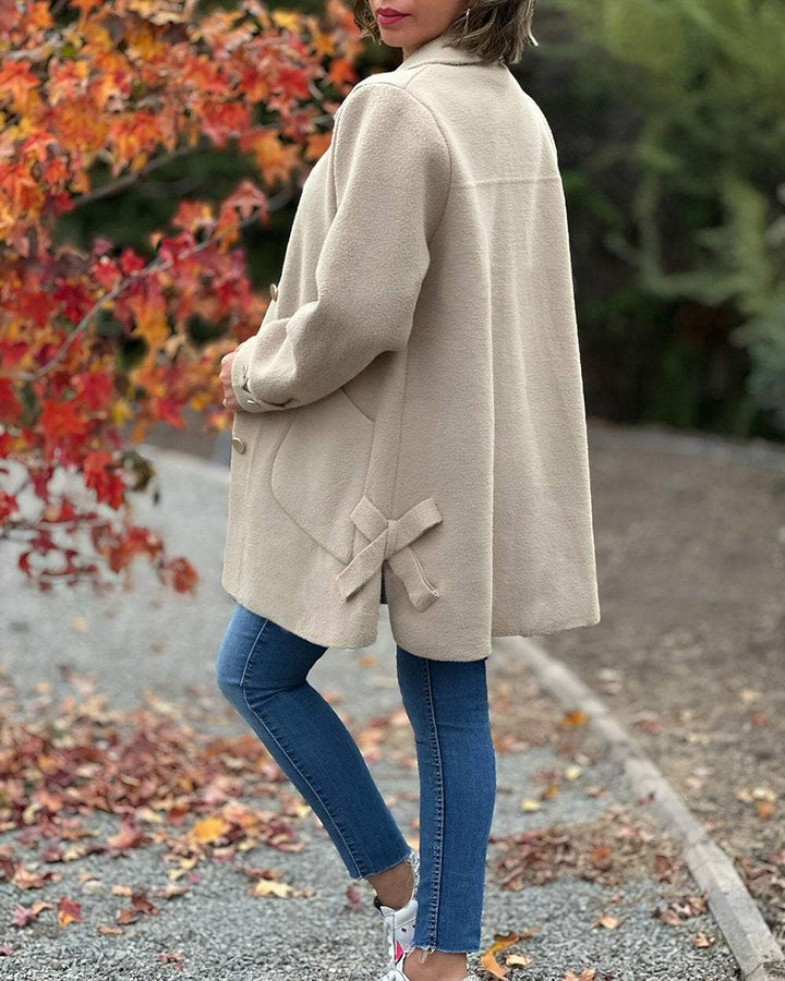 Versatile women's elegant jacket with a stylish side knot. Perfect for office wear or chic casual outfits.