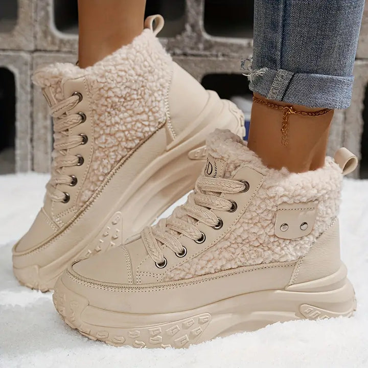 Side view of women's slip-resistant snow boots. Durable sole provides grip for casual, safe winter walking.