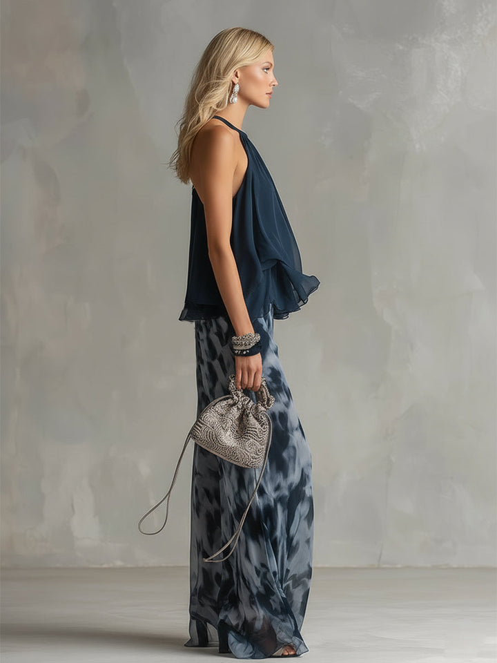Modern navy co-ord set: women's elegant turtleneck top paired with comfortable wide-leg trousers for versatile fashion.