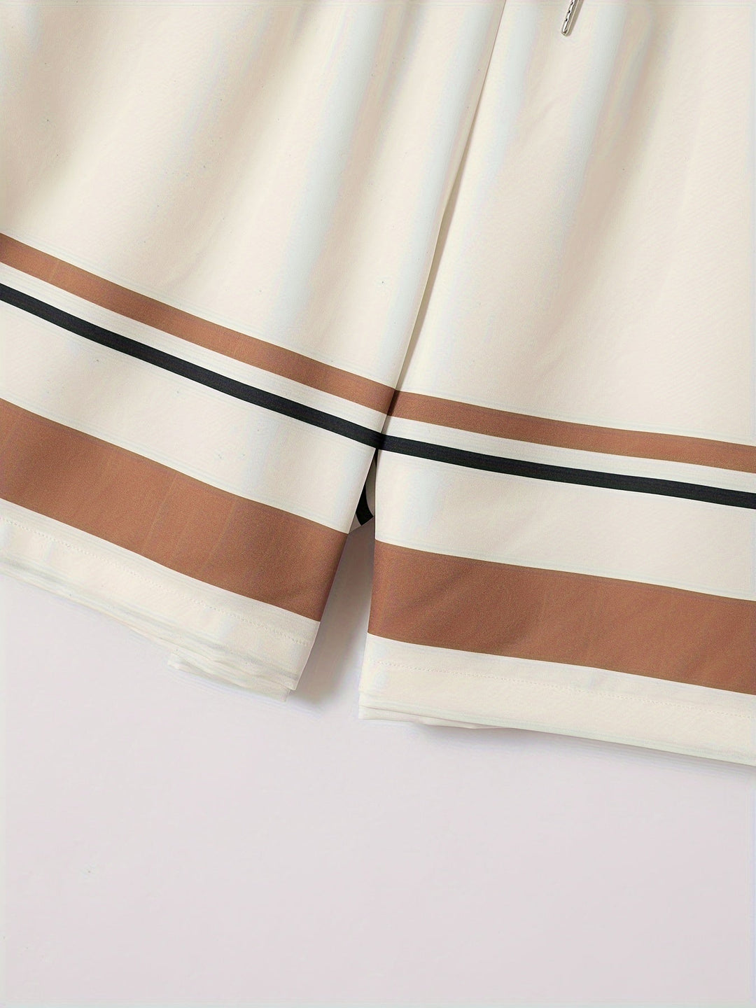 Men's striped beach outfit: a short sleeve button shirt and relaxed fit drawstring shorts, ideal for summer fashion.