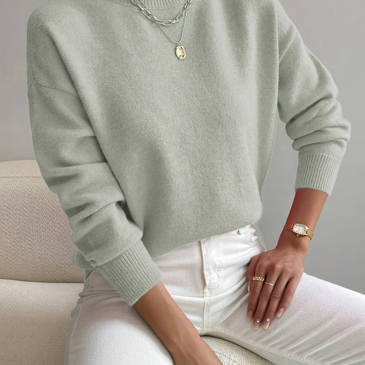 Fashionable ladies' knitted high neck sweater, ideal for autumn comfort.