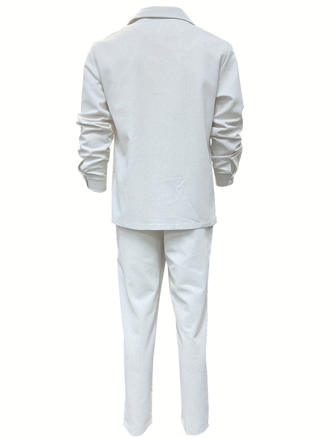 Confident man in a blue minimalist linen blend two-piece set, showcasing versatile men's fashion.