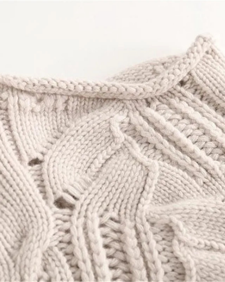 Elegant women's long sleeve knit sweater, ideal for comfortable layering in fall & winter fashion.