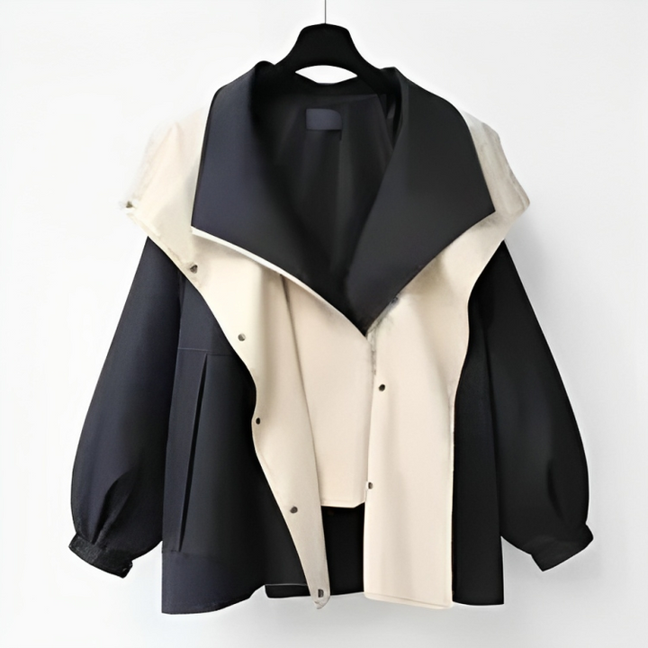 Woman wearing a luxury waterproof raincoat, showcasing its elegant style and protective design.