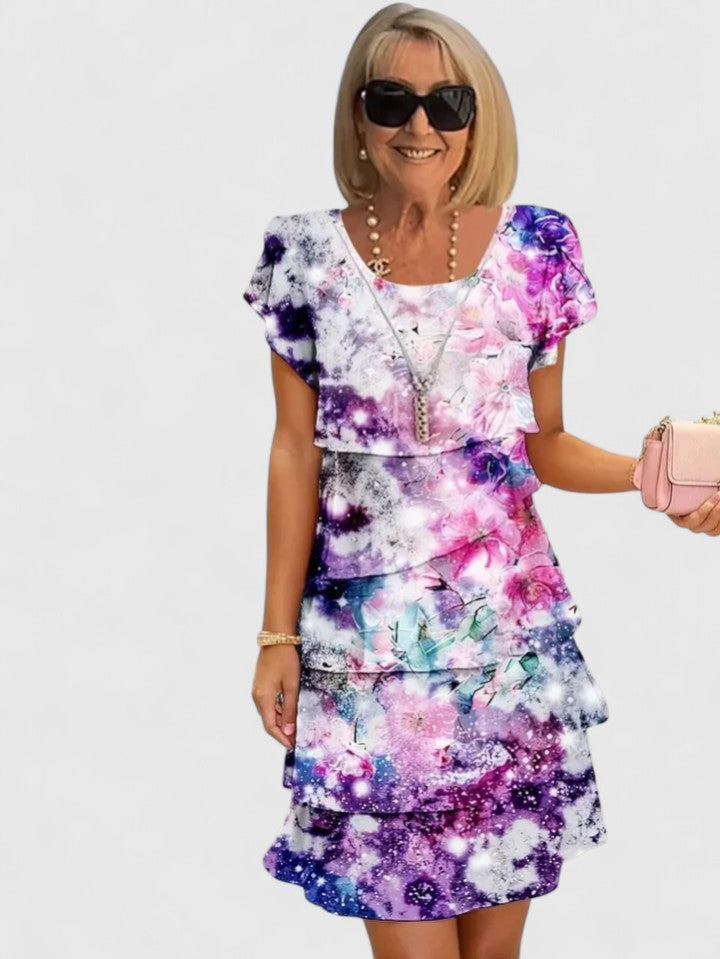 Elegant women's floral tiered midi dress with short sleeves, perfect for summer casual or party wear.