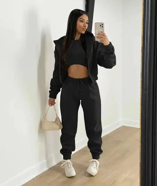 Relaxed fit women's 3-piece outfit: soft cropped hoodie, joggers, & bralette.