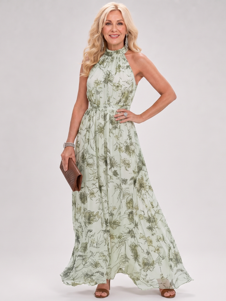 Chic women's floral pattern midi dress with a flattering halter neck design, perfect for warm weather.