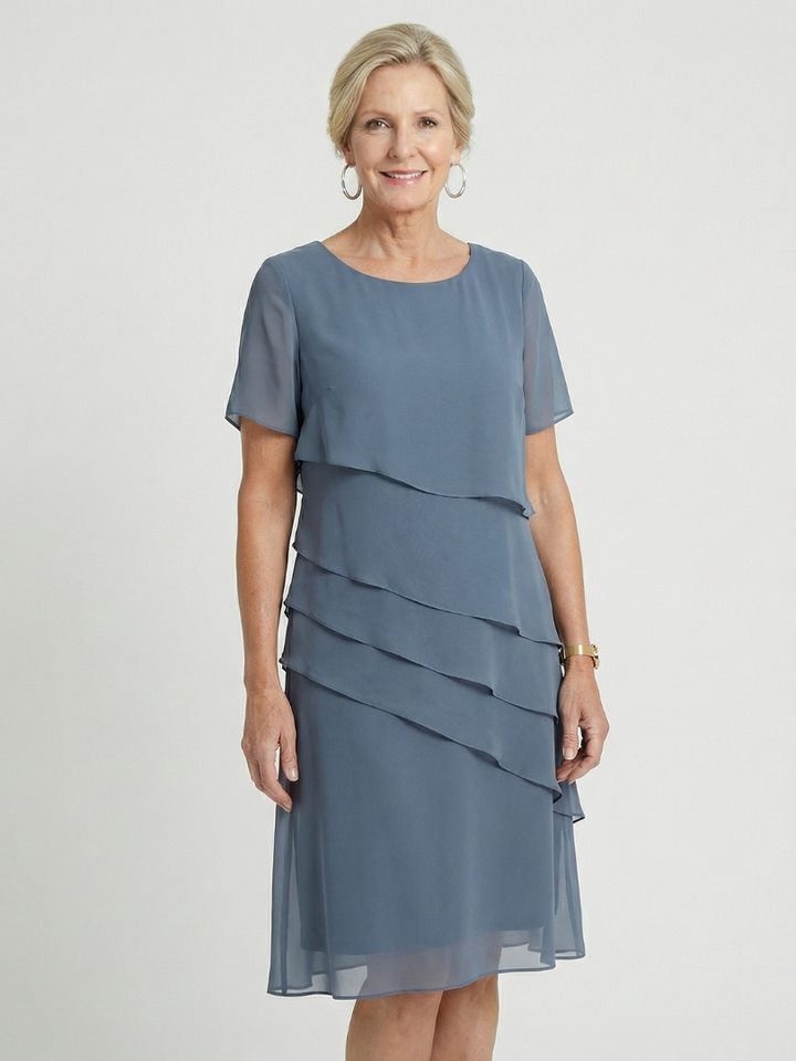Everyday women's knee-length dress with a soft contour, round neck, and short sleeves.