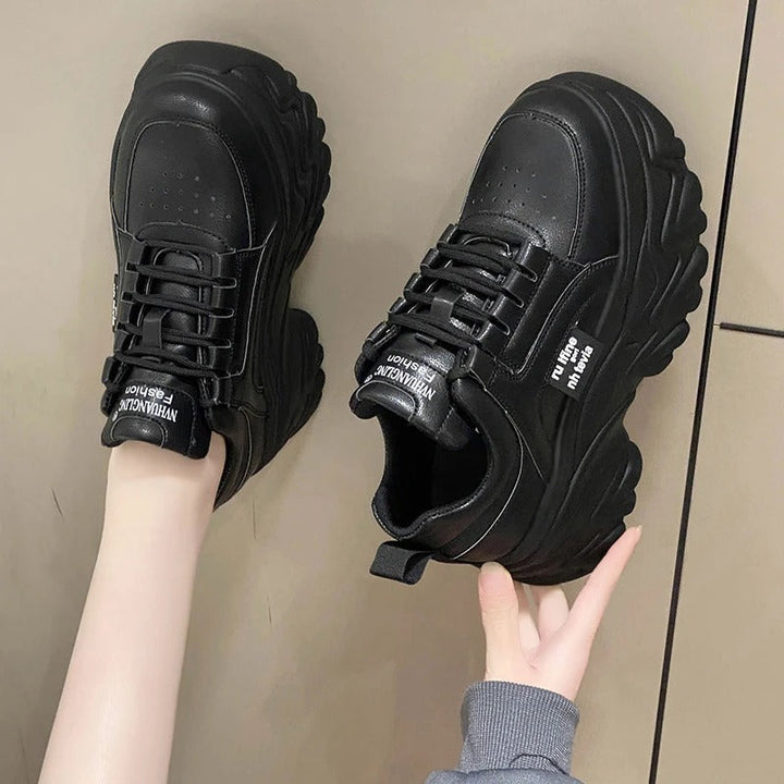 Stylish women's black platform sneakers, chunky sole provides comfort, trendy look & urban appeal.
