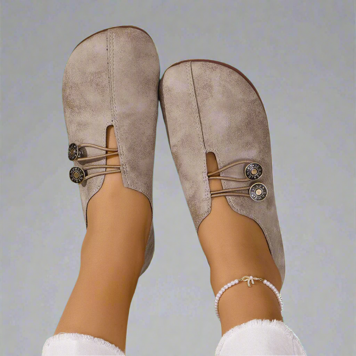 Elegant women's slip-on moccasins, versatile for casual outfits or work, classic flat design.