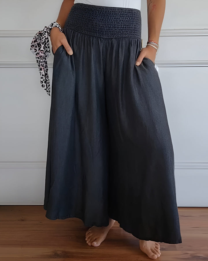 Elegant women's flowy maxi skirt. Smocked waist, side pockets, perfect for comfortable spring & summer outings.