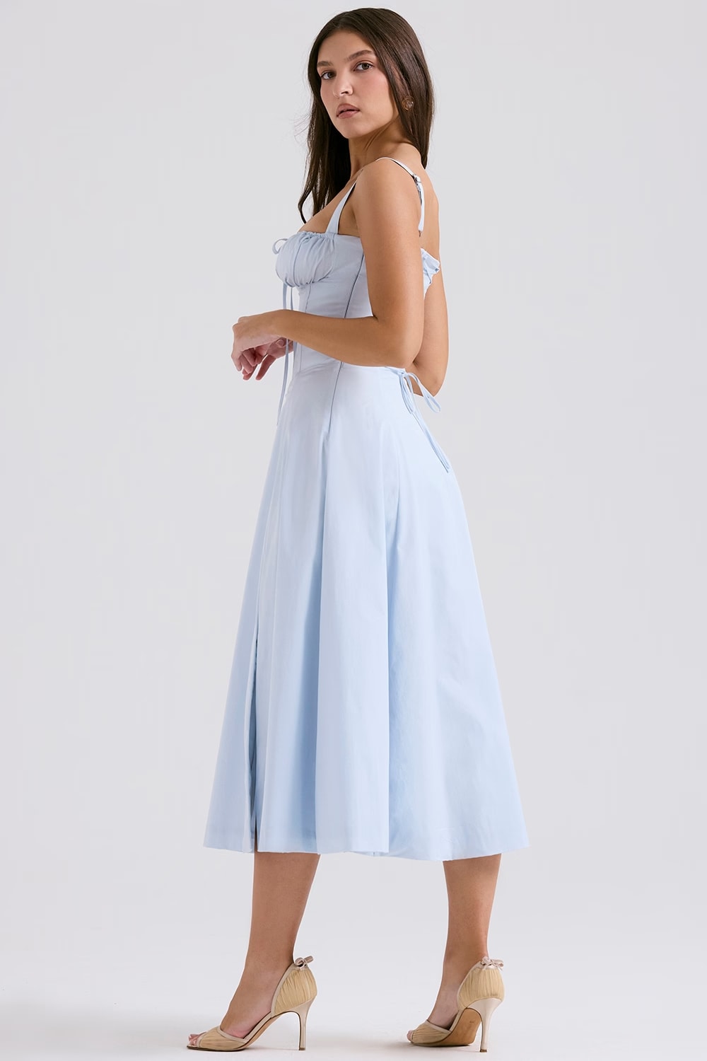 Textured fabric of a women's chic white floral print midi dress with a corset top.