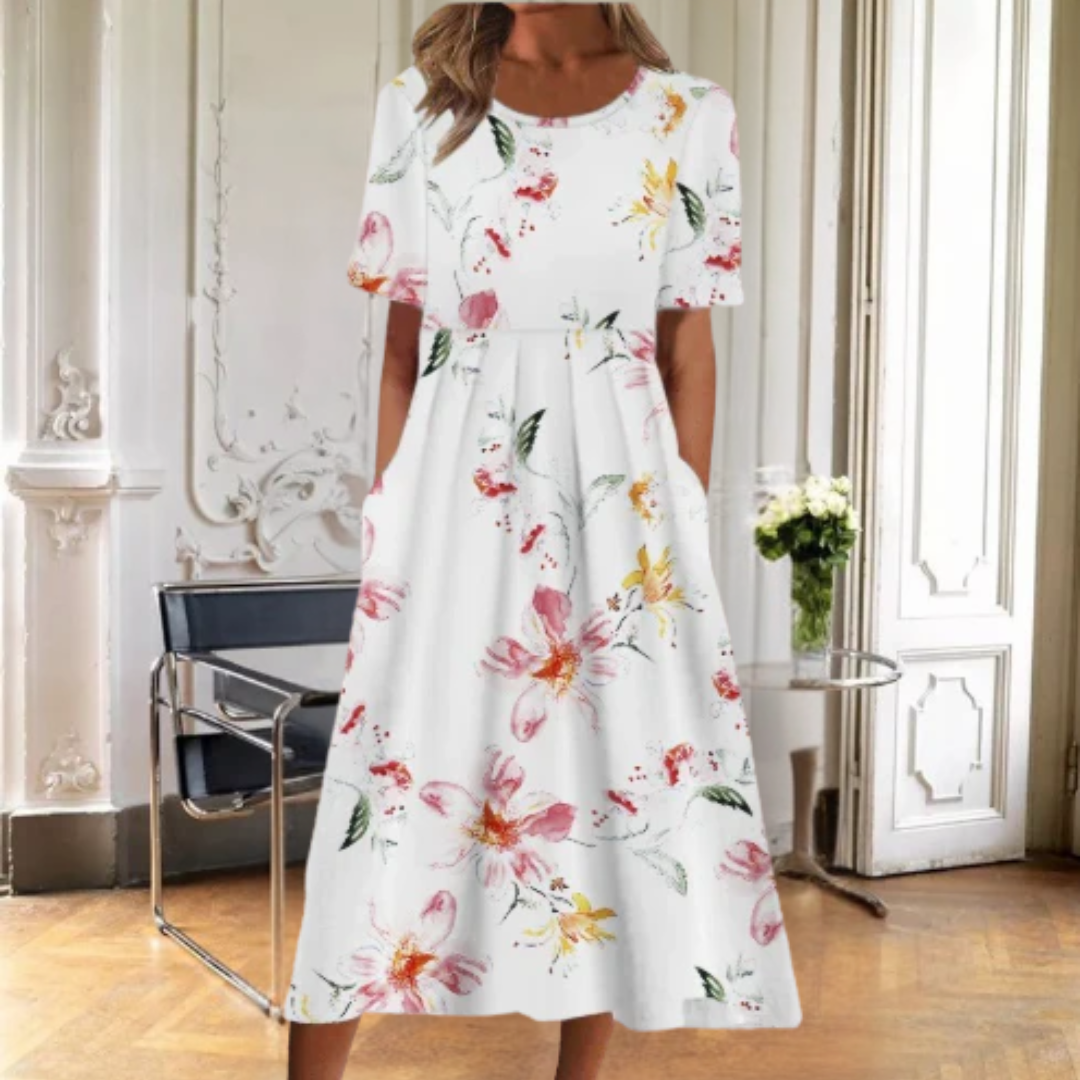 Versatile women's floral midi dress, ideal for casual or day wear. Short sleeve, round neck, and vibrant pattern.