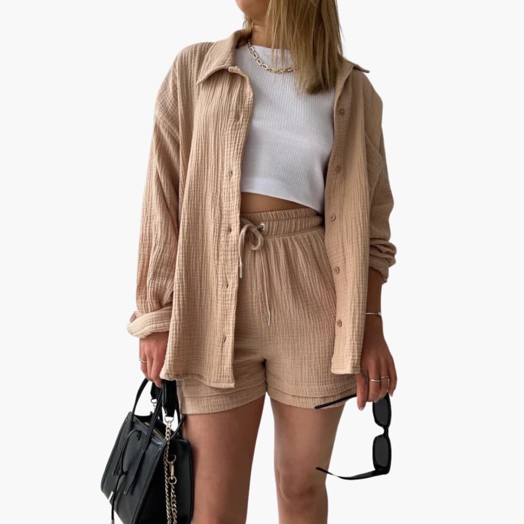 Women's stylish three-piece outfit: button shirt, crop top & high-waist shorts. Perfect for summer fashion.
