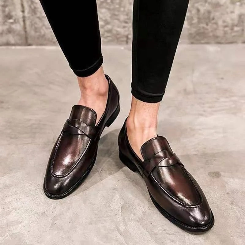 Men's polished black leather slip-on penny loafers for classic smart casual & formal wear.