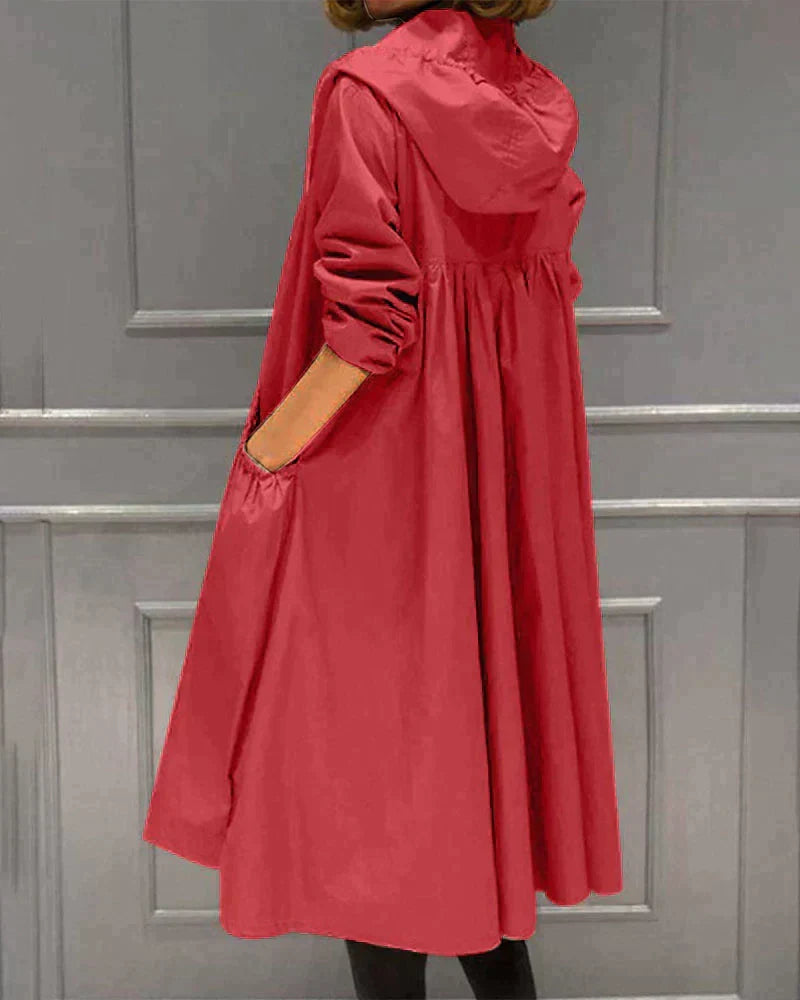 Fashionable women's knee-length waterproof rain jacket, essential stylish rainwear for modern ladies.