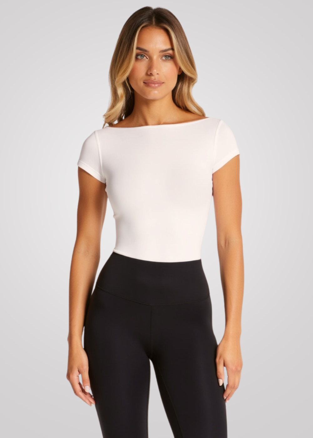 Woman wearing Flow T-Shirt with built-in bra, light support for yoga, pilates & activewear.