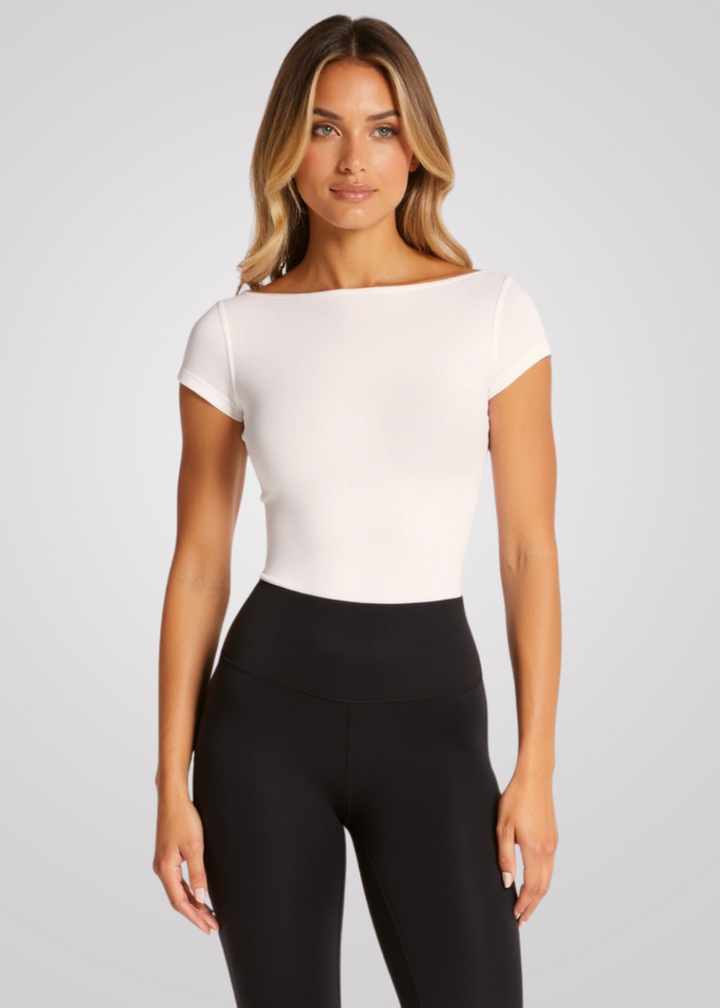 Woman wearing Flow T-Shirt with built-in bra, light support for yoga, pilates & activewear.
