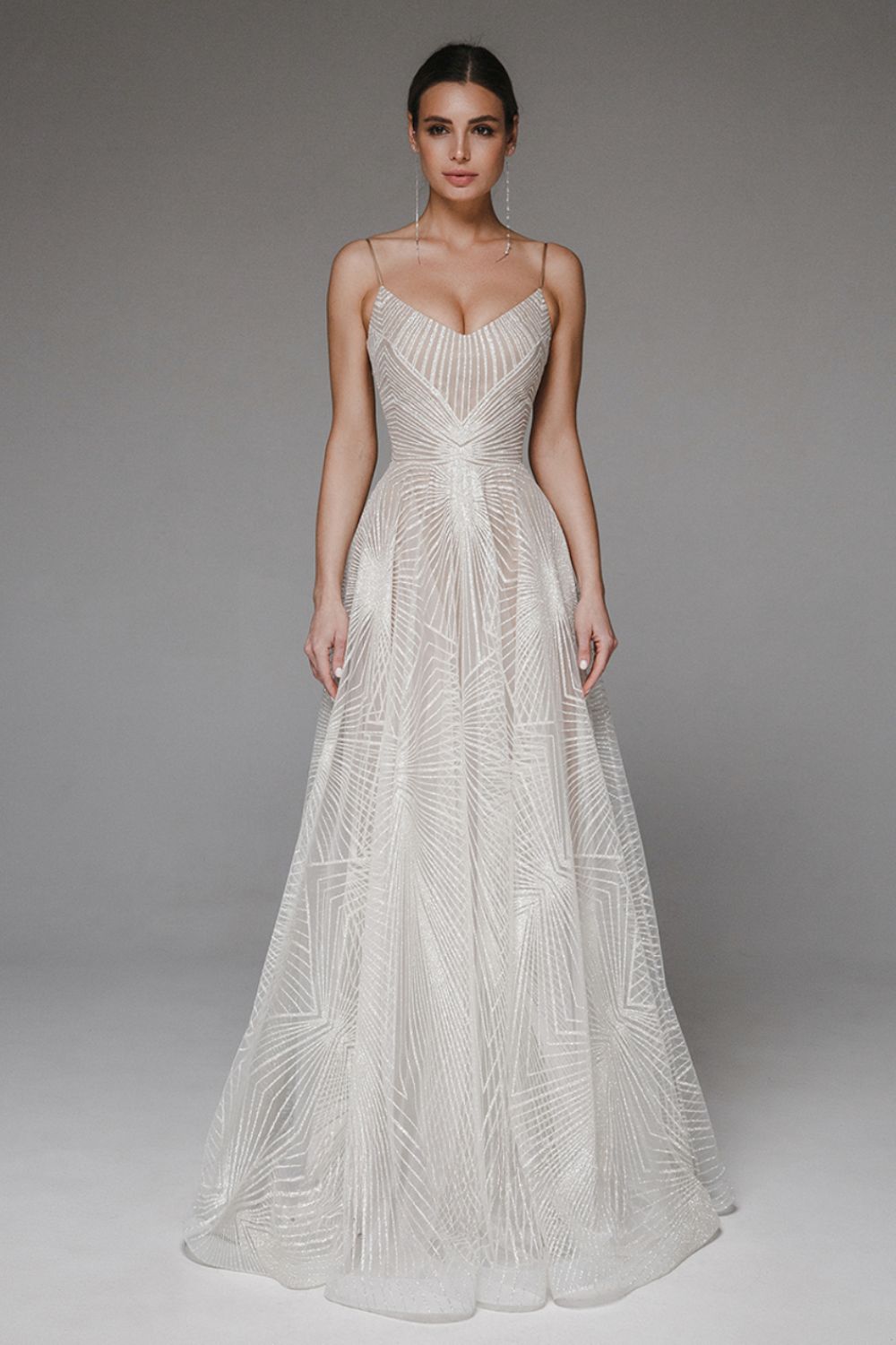 Elegant women's V-neck A-line dress with delicate straps, perfect for formal and special occasions.