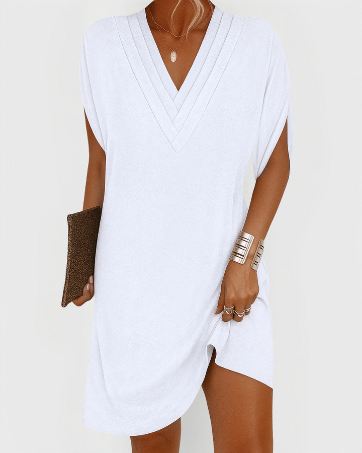 Effortless casual V-neck mini dress for women. Perfect for spring/summer everyday wear. Comfortable short style.