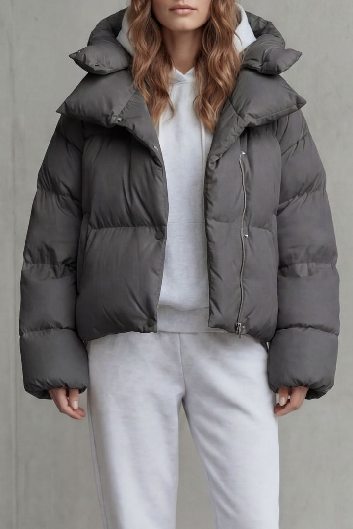 Trendy women's cropped puffer jacket in olive, providing cloud-soft warmth for winter.